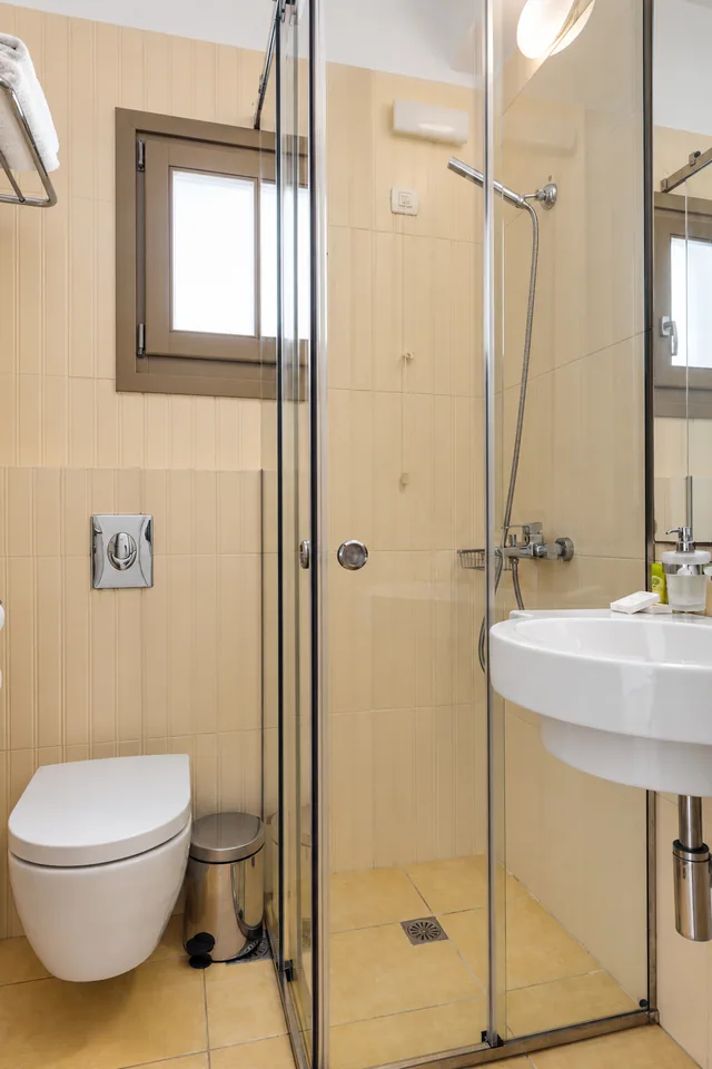 Suite 208 · Bathroom with shower